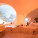 in-one-of-the-bathrooms-which-looks-more-like-a-spa-the-sink-and-bath-are-curved-you-wont-find-any-straight-lines-in-this-house