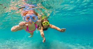 Best summer activities to keep kids learning Happy family - mother with baby girl dive underwater with fun in