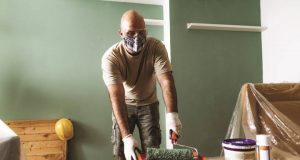 How to Stay Safe During Your Remodel Amid COVID-19 painting a wall
