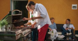 Tips for Online Grill Shopping family grilling outdoors on patio