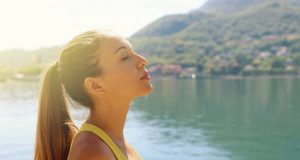 Tips to Promote Health During Spring woman breathing freely