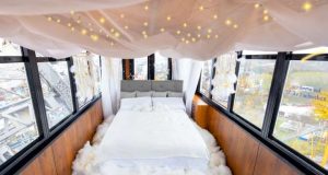 Floating on Cloud Nine: Emma Transforms Ferris Wheel Carriage into a Bedroom